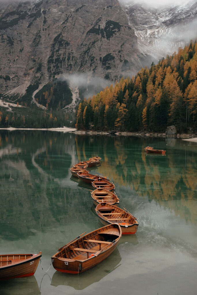 Boats lined up on the lake at Lago di Braies